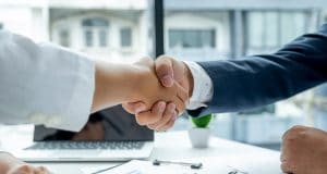 Photo of business partners shaking hands.